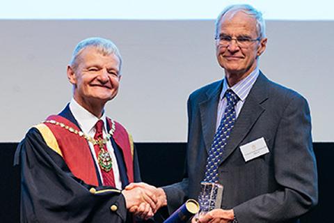 Derek Knottenbelt receiving the RCVS Inspiration Award from former RCVS President Professor Stephen May