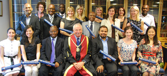 RCVS President Jerry Davies with new MsRCVS at Belgravia House