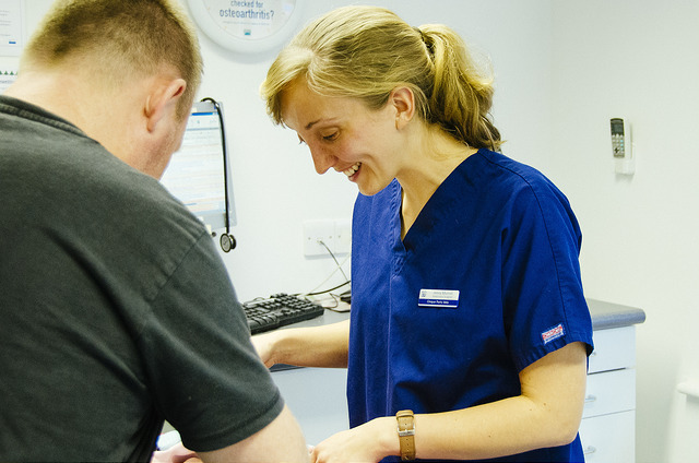 Veterinary surgeon talking to client 