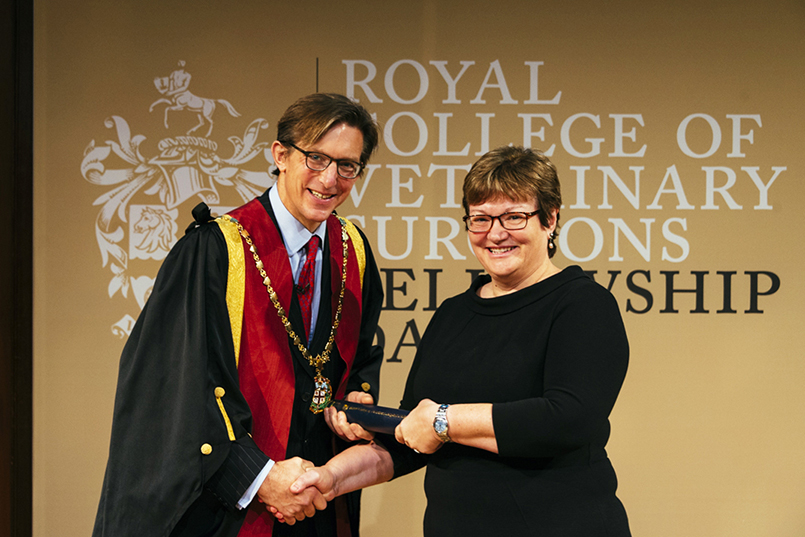 Professor Sue Dawson receiving her Fellowship from Chris Tufnell
