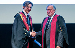 Dr Chris Tufnell awarding Barry Johnson the Queen's Medal