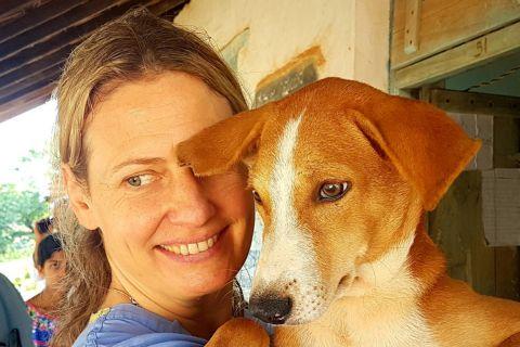 Dr Ursula Goetz with a street dog