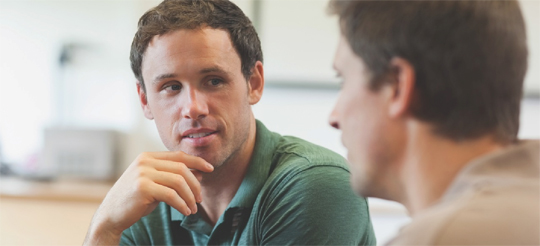 Two men in conversation