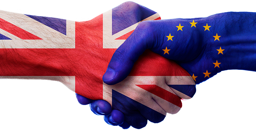 Handshake featuring EU and British flags