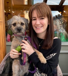 Becky pictured holding a border terrier