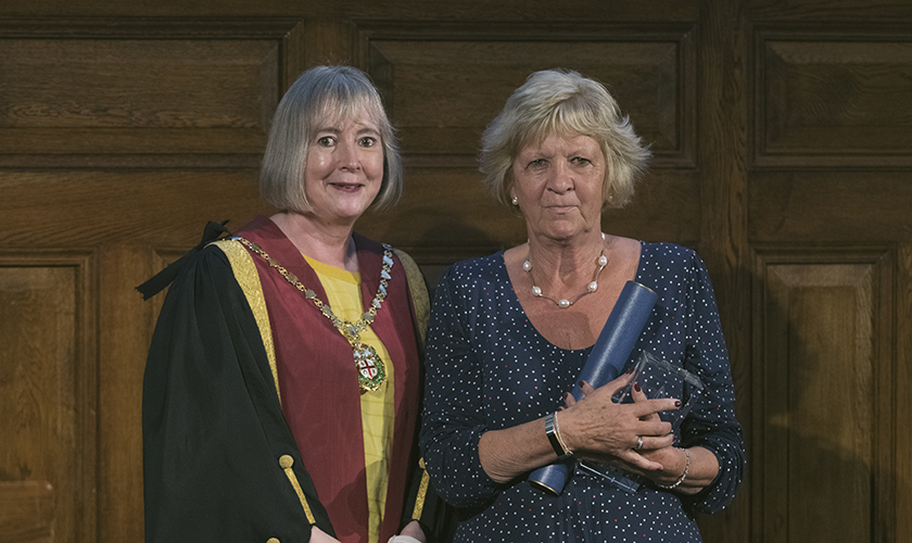 Joyce Wason receives the RCVS Honorary Associateship from Kate Richards at Royal College Day 2022 