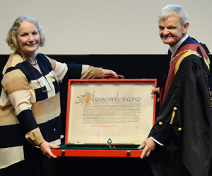 Judy MacArthur-Clark presenting Lord Soulsby's scroll to Stephen May Royal College Day 2018