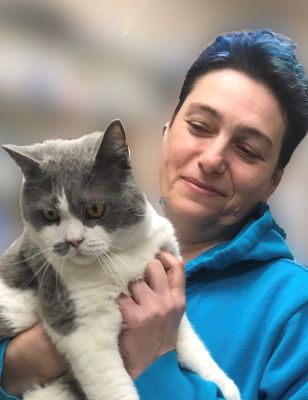 Justyna Borkowska-Rozanska holding a grey and white cat