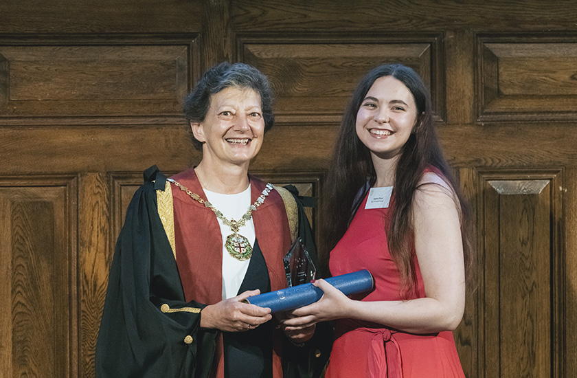 Sophie Oliver receiving the Student Community Award from Melissa Donald 