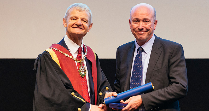 Stephen May presents Queen's Medal 2018 to Peter Clegg