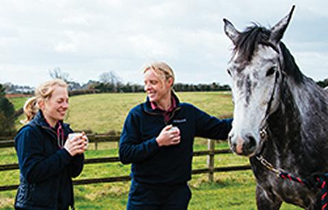 Two Advanced Practitioners with a horse 
