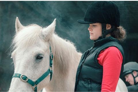 Woman and a white horse