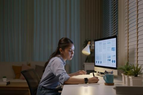 Woman working on research at desk 