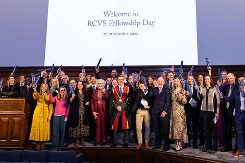 RCVS President Professor Tim Parking FRCVS on stage with new Fellows at Fellowship Day 2025 